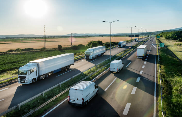 trucks driving on a sunny day